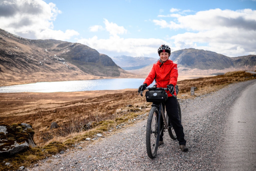 Rosie Baxendine, stood astride her bike in the Perthshire countryside